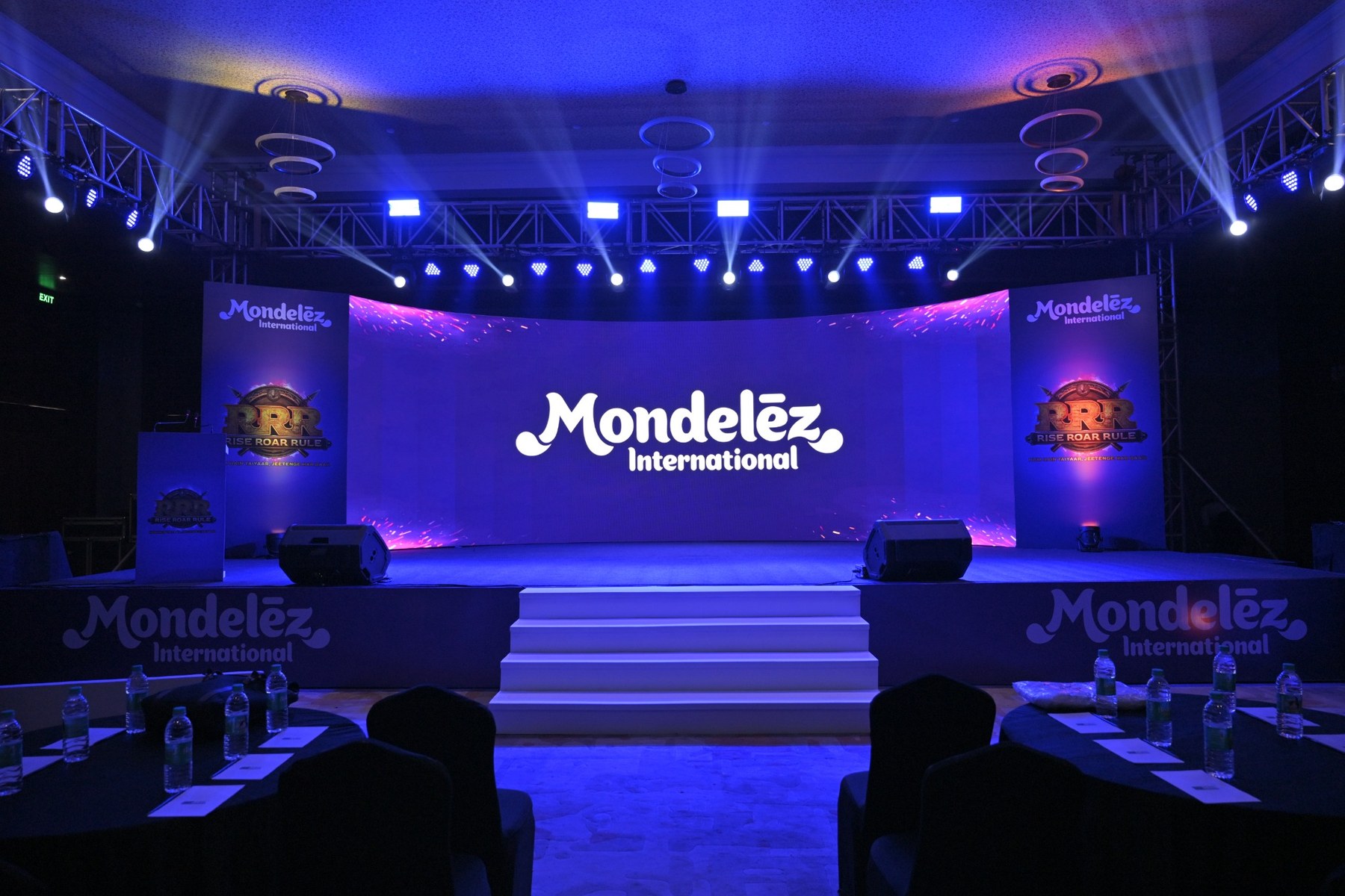 Branded stage setup for a corporate event executed by The Brand Buddies