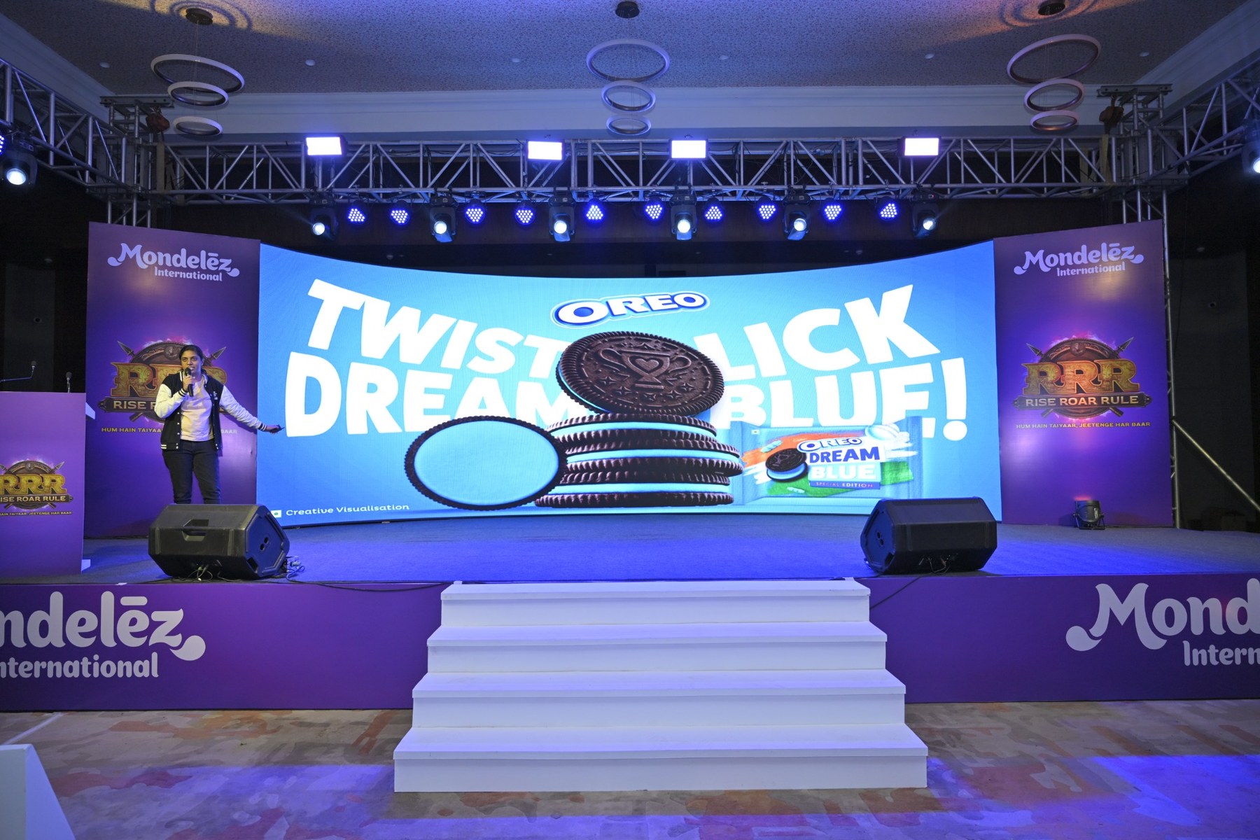 Branded product showcase on stage during a corporate event hosted by The Brand Buddies